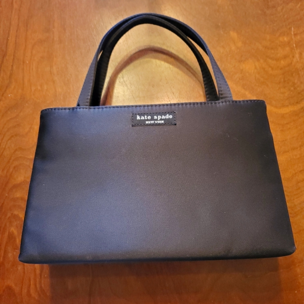 Kate Spade Black Mini Sam Evening Bag
(Also have the matching wallet available)